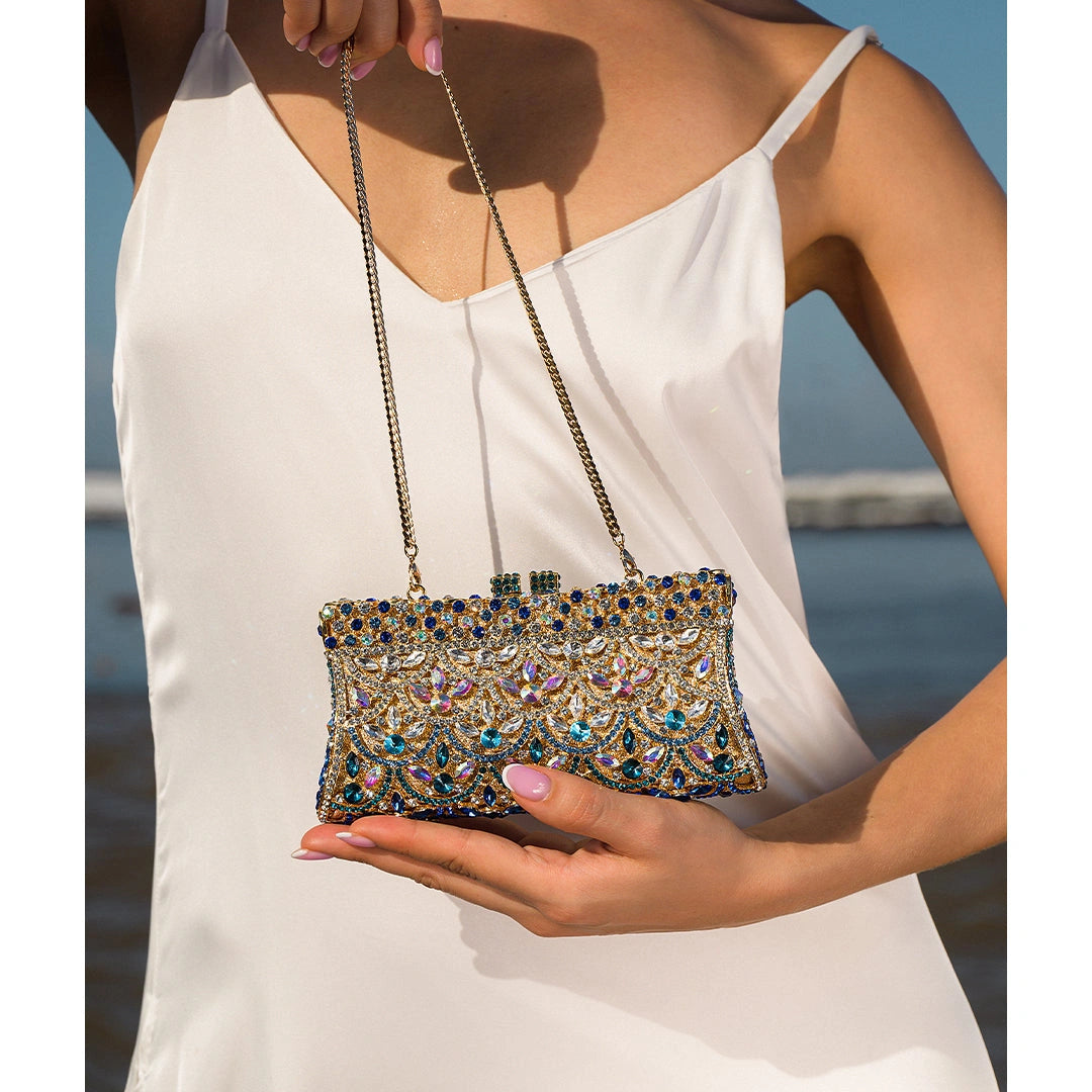 Elegant clutch bag in a soft fabric, featuring fold over flap and gold tone clasp, shown close up view — 5 — view 5