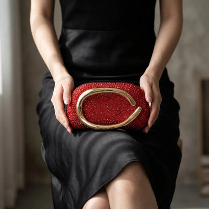 Elegant black clutch bag with a textured finish, featuring sleek silhouette and gold tone clasp, front view — 13 — view 13