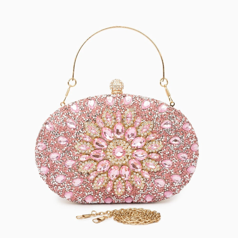 Elegant clutch bag in a soft fabric with sleek silhouette, featuring gold tone clasp and subtle textured finish — view 16