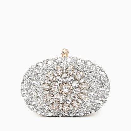 Elegant clutch bag in soft leather with a sleek silhouette, featuring gold tone clasp and subtle textured finish — view 22