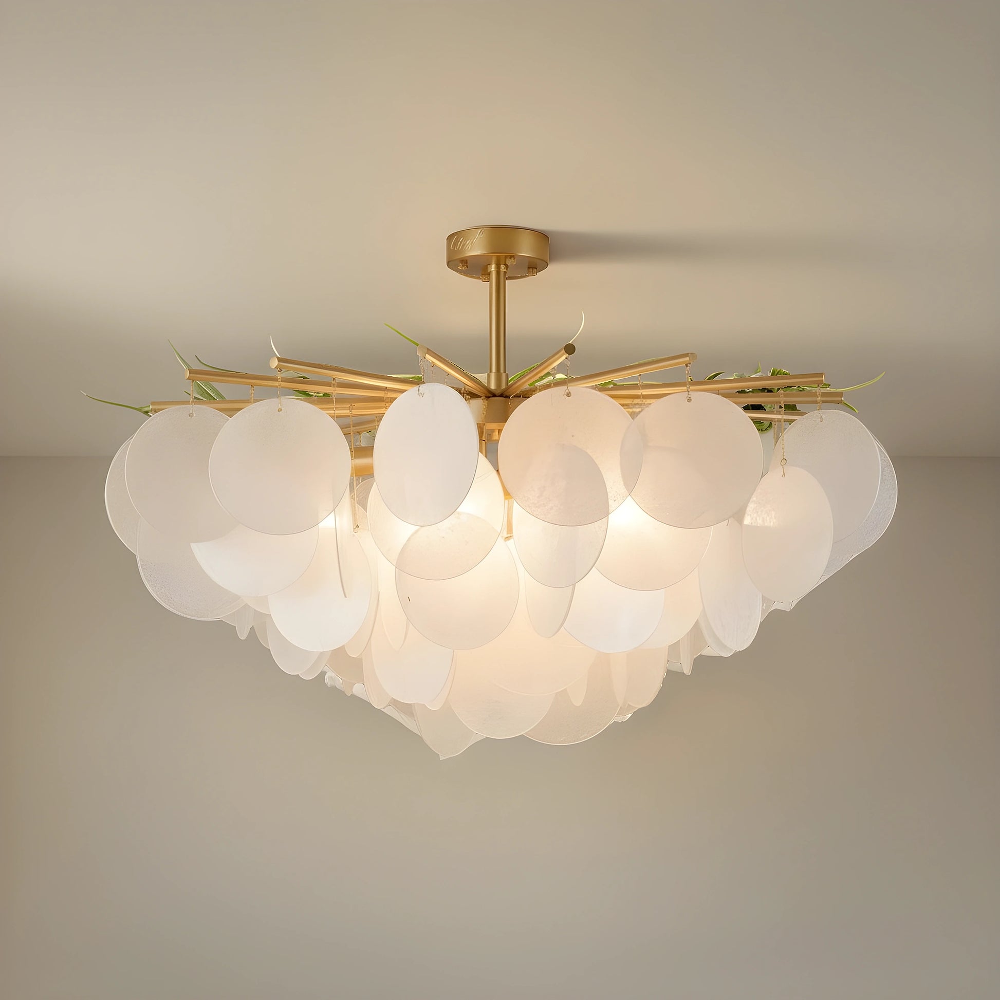 Close up of the Layered Glass Chandelier showing its glass layers and intricate design against a white background, showing its contemporary style.