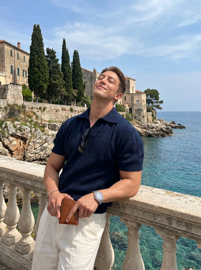 Close up view of the Mens Refined Relaxed Spring Polo Shirt showing the soft fabric texture, precise stitching, and collar against a neutral background.