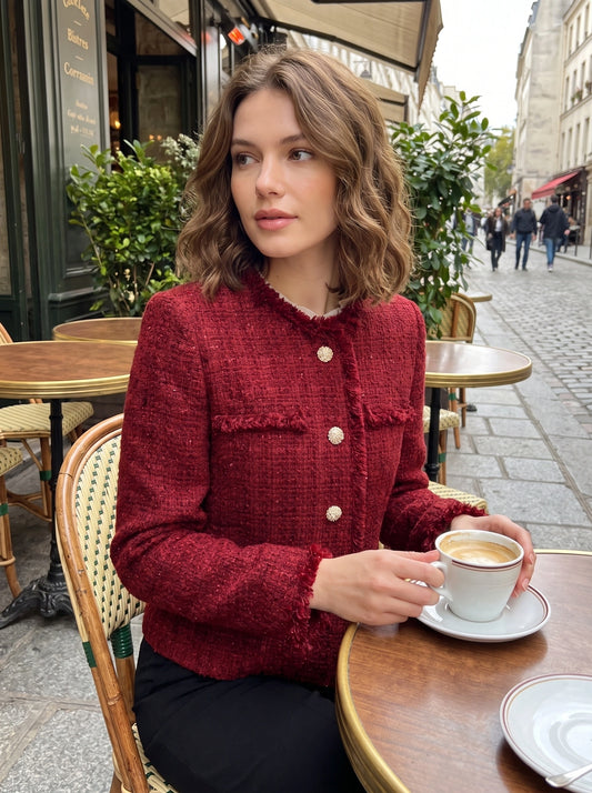 A model showcases the Womens Textured Autumn Jacket in a rich burgundy hue, styled with high waisted trousers against a soft neutral background.