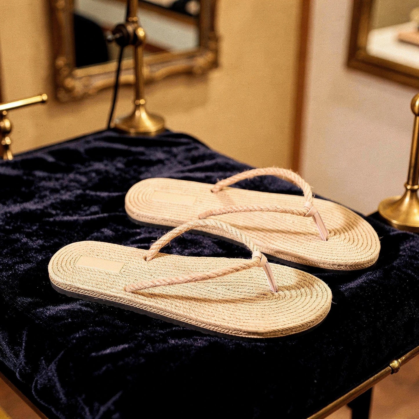 View of chic casual straw flip flop sandals in light beige with a textured surface and comfortable footbed