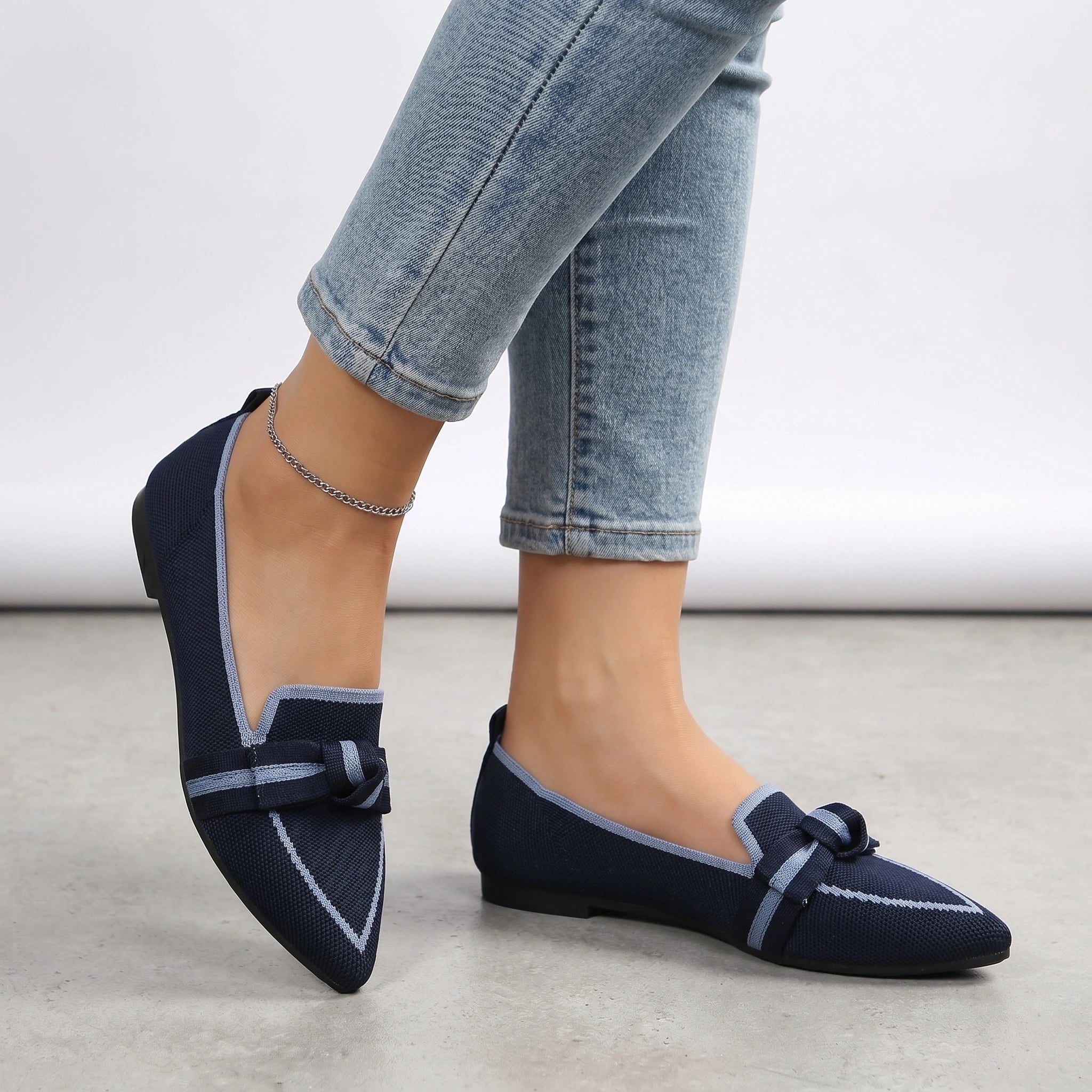 Back view of a model wearing Womens Supportive Orthopedic Loafers in a versatile neutral color, showing the shoe's construction and supportive design.
