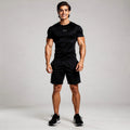 View of a reflective elastic athletic gym tee in dark gray, featuring short sleeves and a comfortable fit