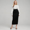 View of a women's elegant slim midi skirt in soft fabric, featuring a fitted silhouette and a classic solid color