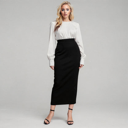 View of a women's elegant slim midi skirt in soft fabric, featuring a fitted silhouette and a classic solid color