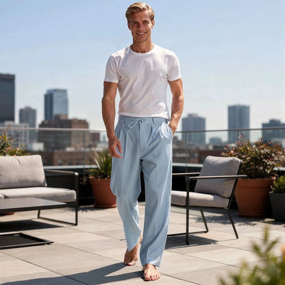 Light gray relaxed fit drawstring pants with pockets and elastic waistband, view showcasing fabric texture