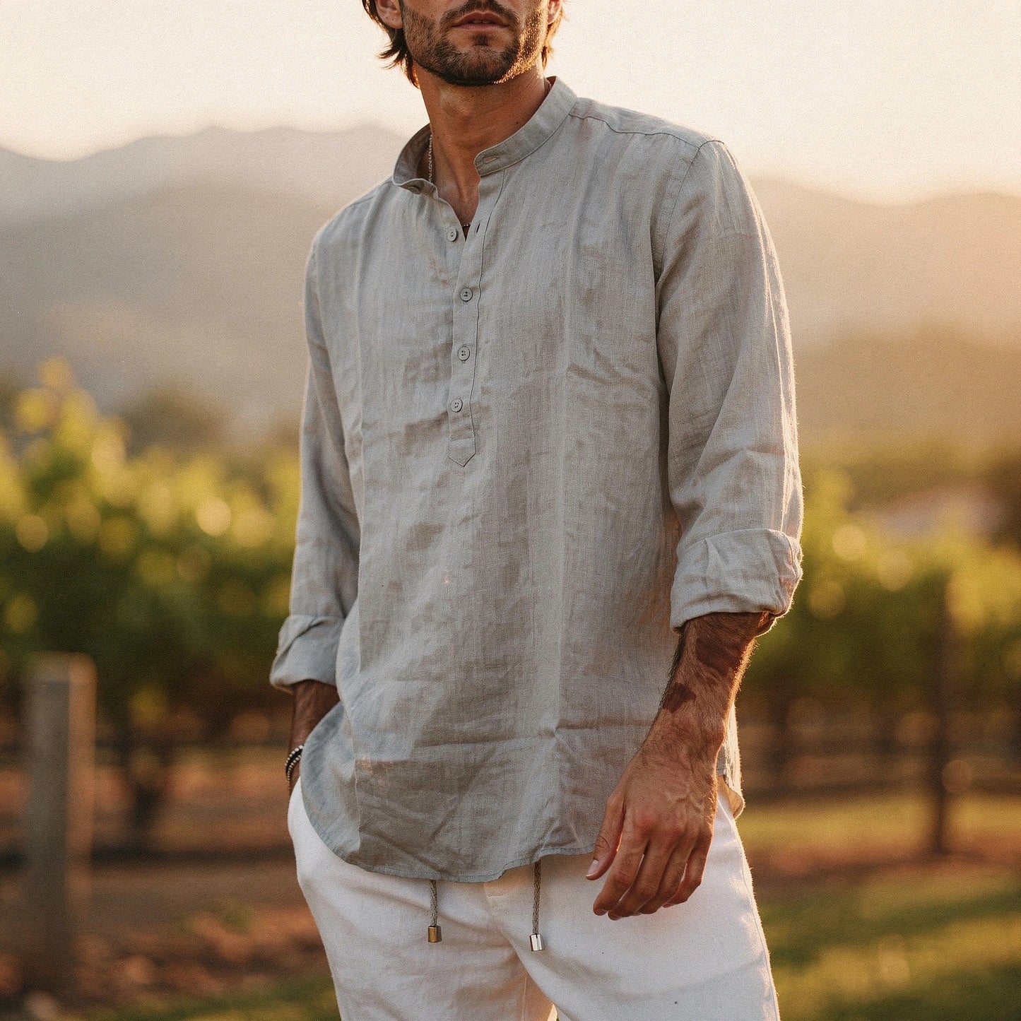 Lightweight summer henley shirt in soft cotton, featuring a relaxed fit, short sleeves, and a buttoned placket in a light gray color