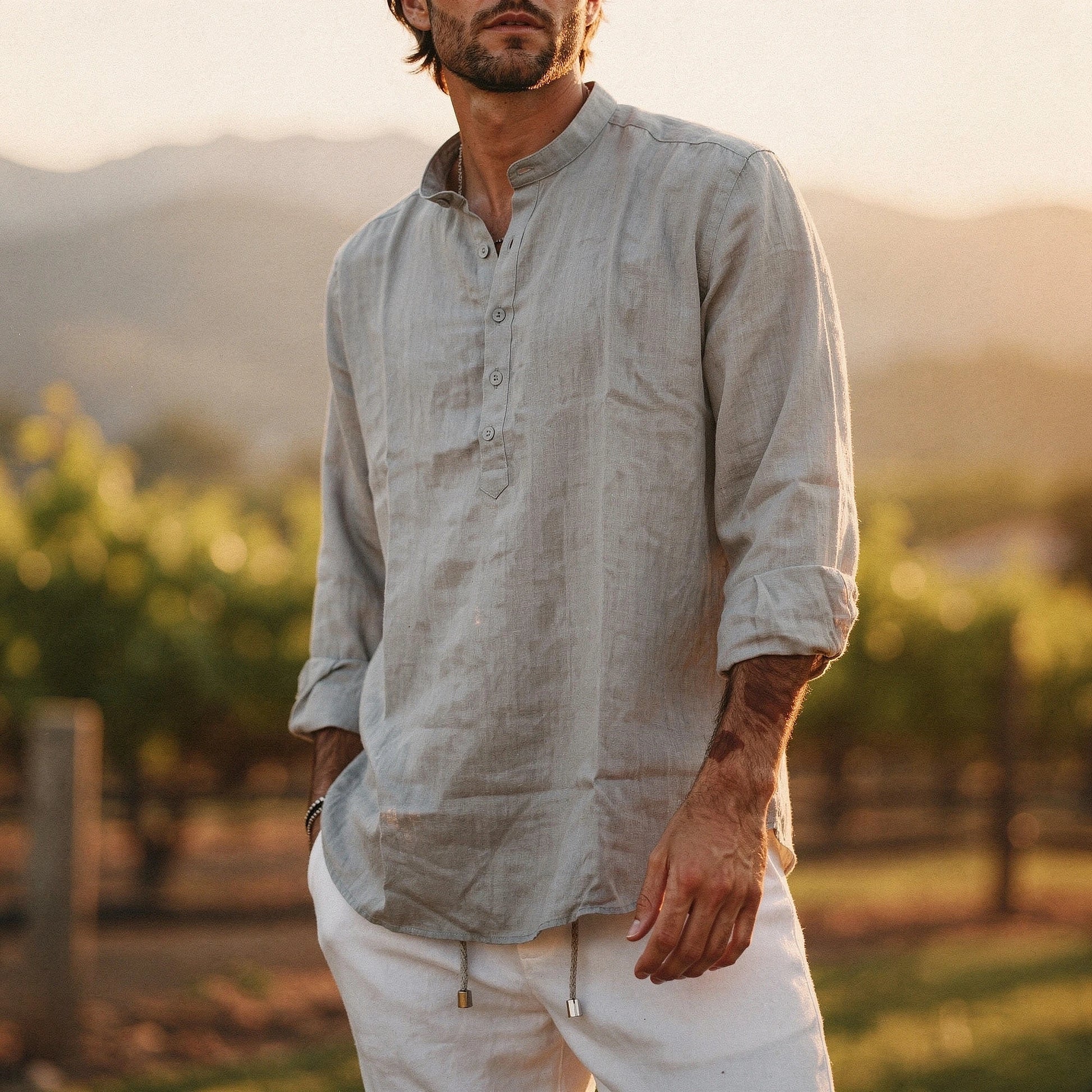 Lightweight summer henley shirt in soft cotton, featuring a relaxed fit, short sleeves, and a buttoned placket in a light gray color