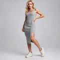 View of a relaxed knitted midi dress in soft beige with a slit and short sleeves