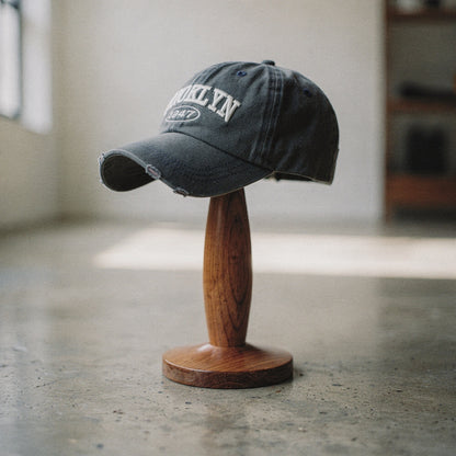 View of a khaki green embroidered cap featuring a casual chic design and adjustable strap at the