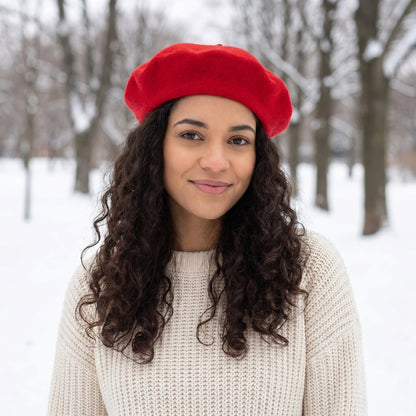 A model showcases the Womens Timeless Classic Wool Beret in a winter outfit, showing neutral tones against a soft, muted background.