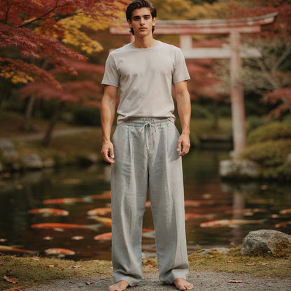 View of relaxed lightweight casual trousers in light gray, featuring a comfortable fit and subtle pocket details