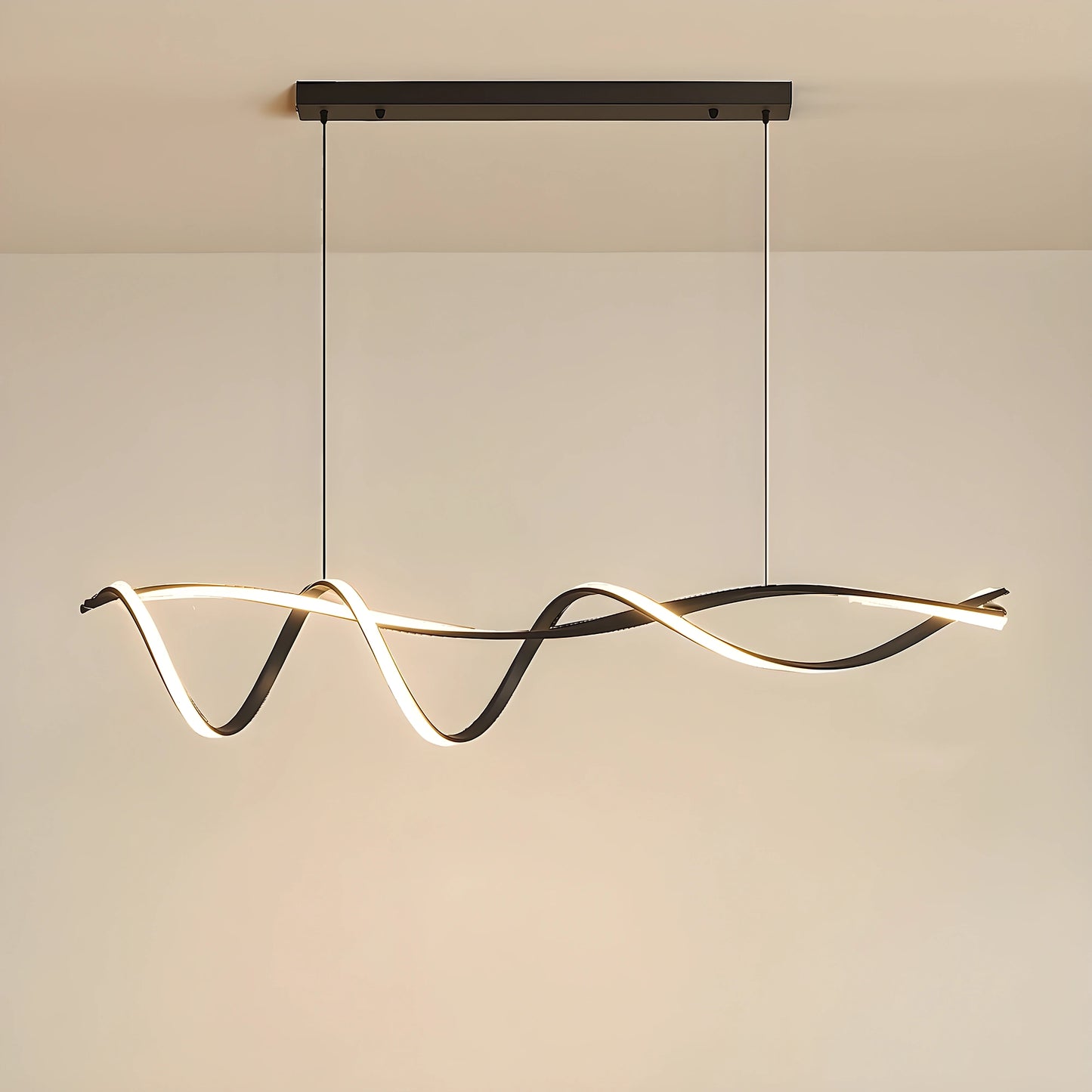 A sculptural LED overhead light fixture showcased in a modern space, showing its wave inspired design and finish against a minimalist background.