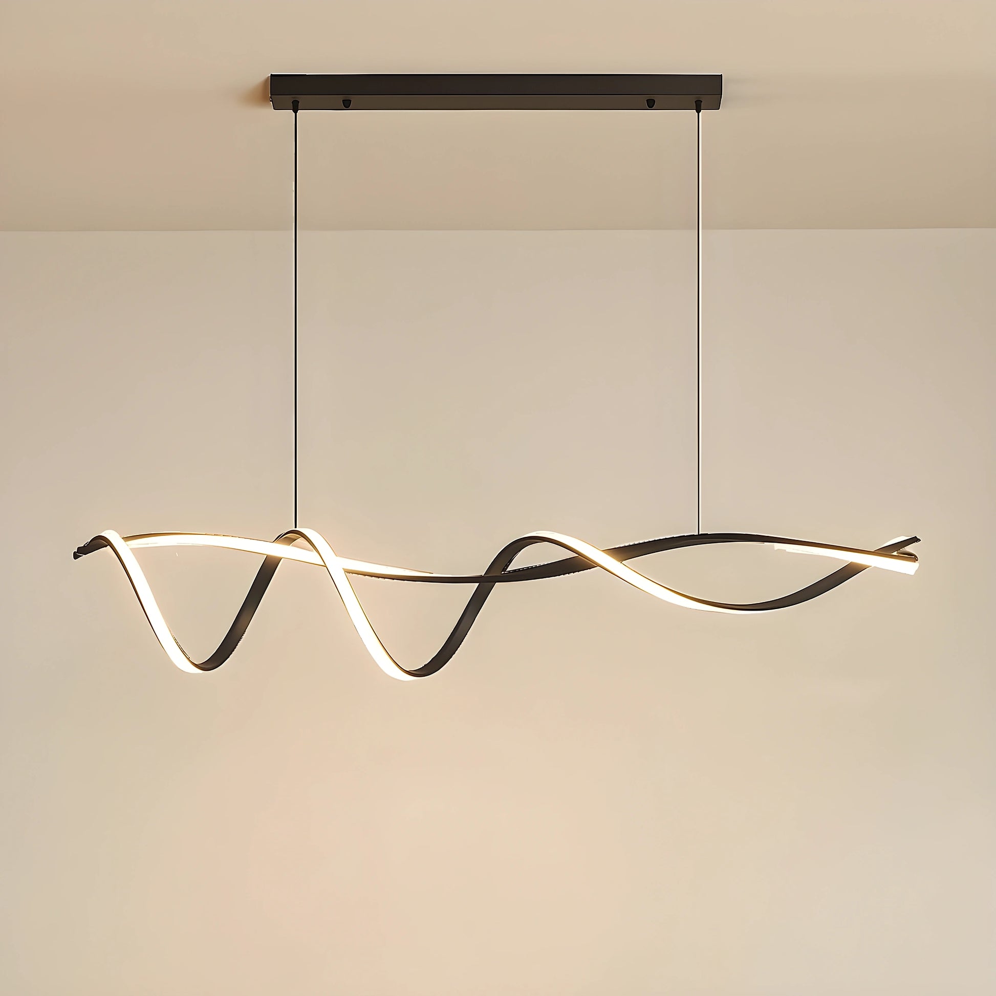 A sculptural LED overhead light fixture showcased in a modern space, showing its wave inspired design and finish against a minimalist background.