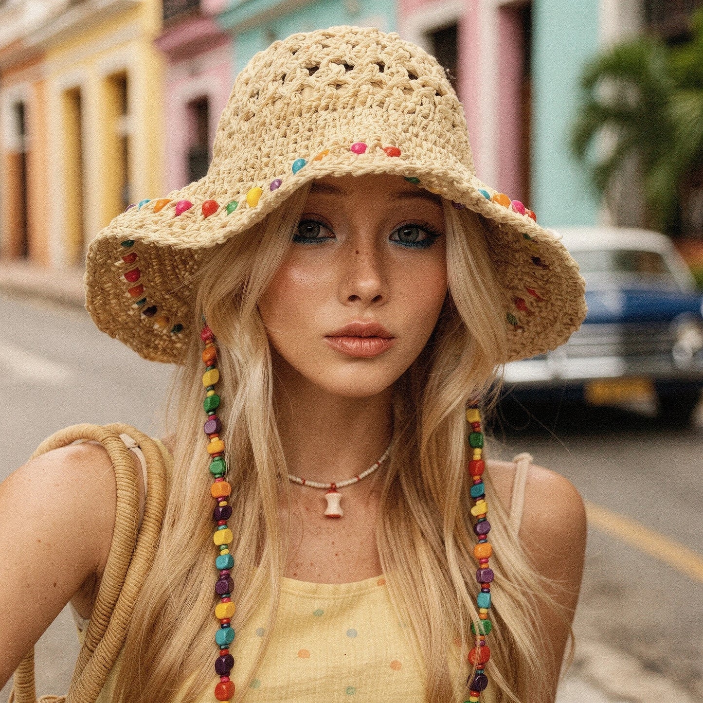 Colorful crochet summer bucket hat in a view, featuring a vibrant pattern and lightweight material perfect for warm weather