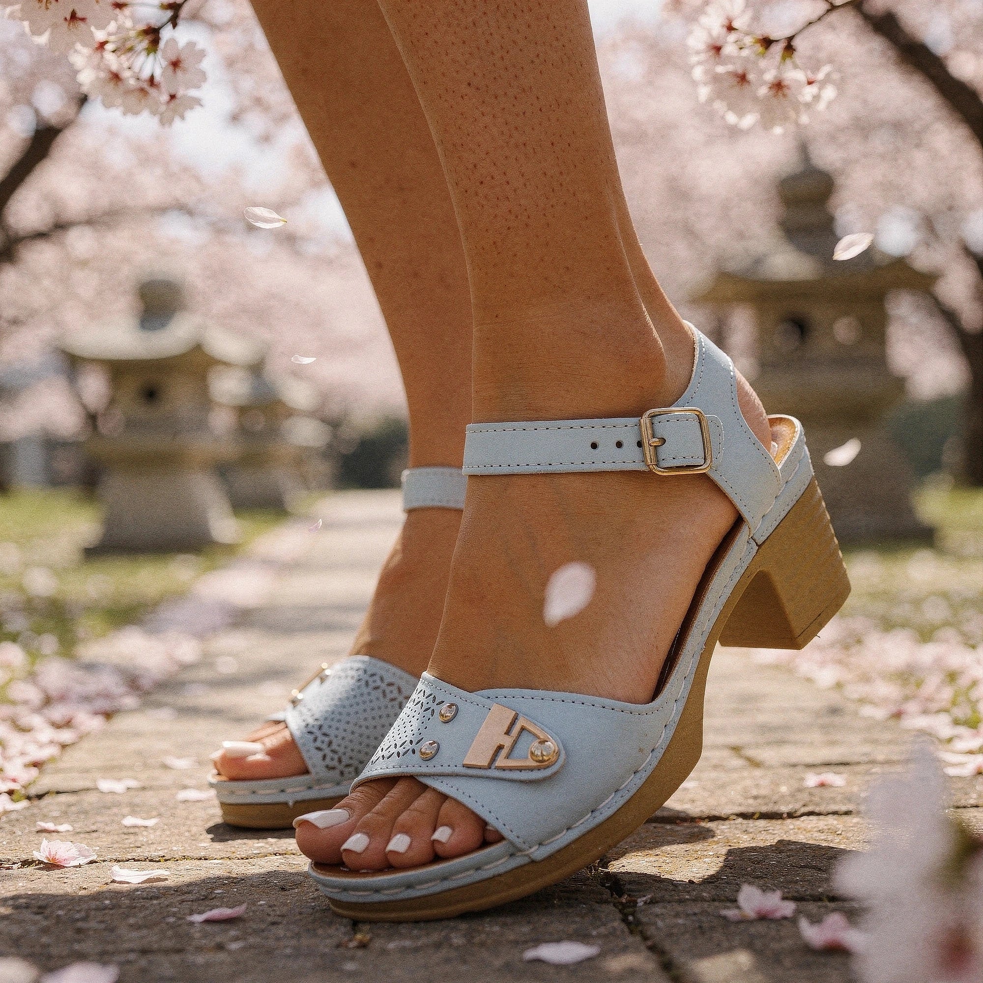 View of chic adjustable buckle chunky heel sandals in tan, featuring a sturdy heel and soft material, perfect for summer wear