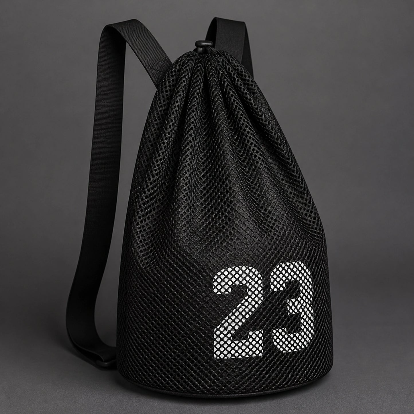 drawstring backpack — Black mesh athletic drawstring ball backpack, strap and material detail — view 5