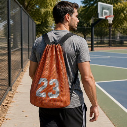 drawstring backpack — Adult wearing orange and black mesh athletic drawstring ball backpack at a basketball court — view 6