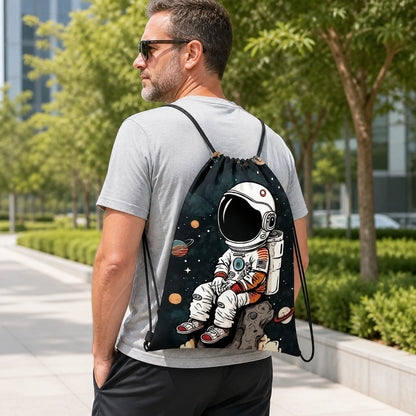 Adult wearing the navy blue astronaut print drawstring backpack outdoors — view 4