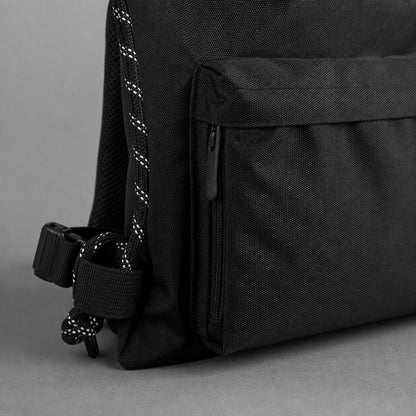 Black drawstring backpack, zipper cord and hardware detail — view 3