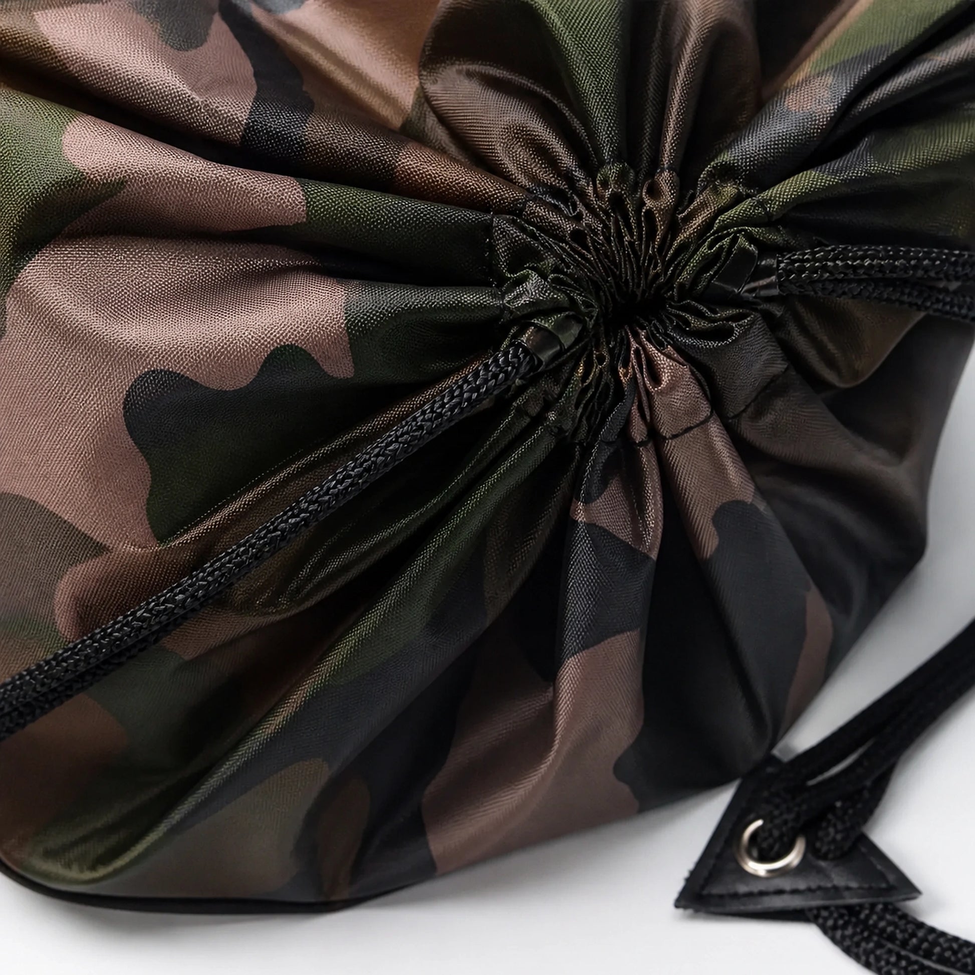 Woodland camouflage drawstring backpack, reinforced corner and cord detail — view 3