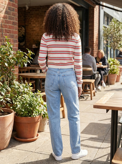 Close up view of the Womens Striped Autumn Cardigan showing the soft fabric texture, intricate stitching, and colorful contrast of the stripes.