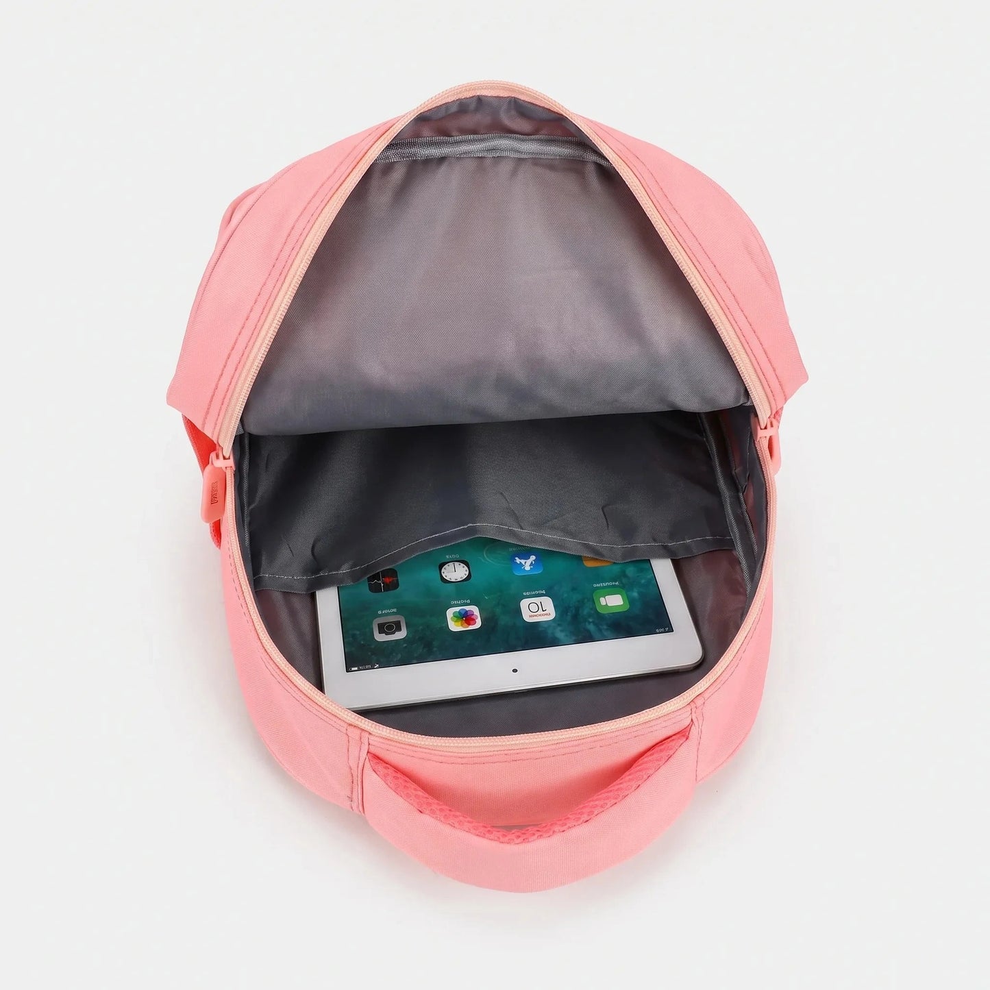 View of a cheerful lightweight kids backpack featuring a colorful cartoon print, showcasing adjustable straps and a zippered compartment
