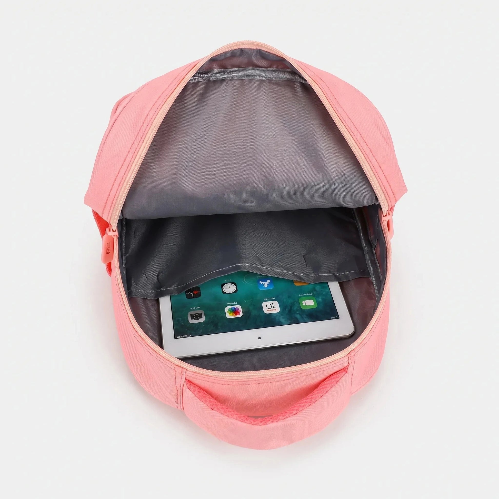View of a cheerful lightweight kids backpack featuring a colorful cartoon print, showcasing adjustable straps and a zippered compartment