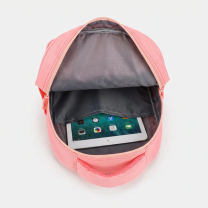 View of a cheerful lightweight kids backpack featuring a colorful cartoon print, showcasing adjustable straps and a zippered compartment