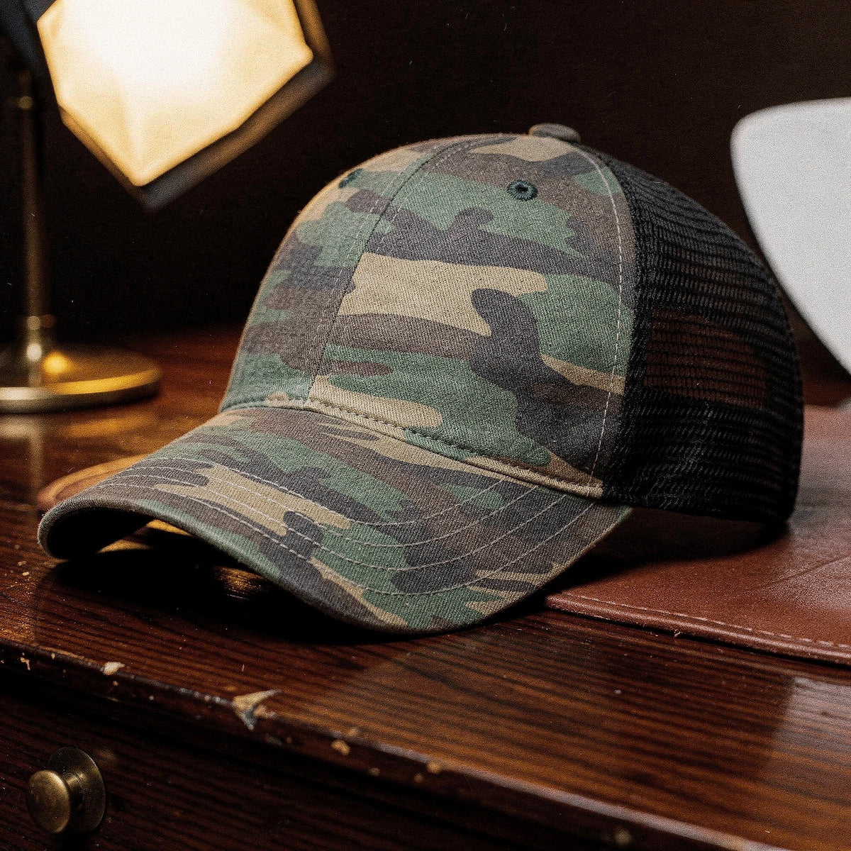 View of a relaxed vintage snapback cap in dark green, featuring a curved brim and adjustable strap