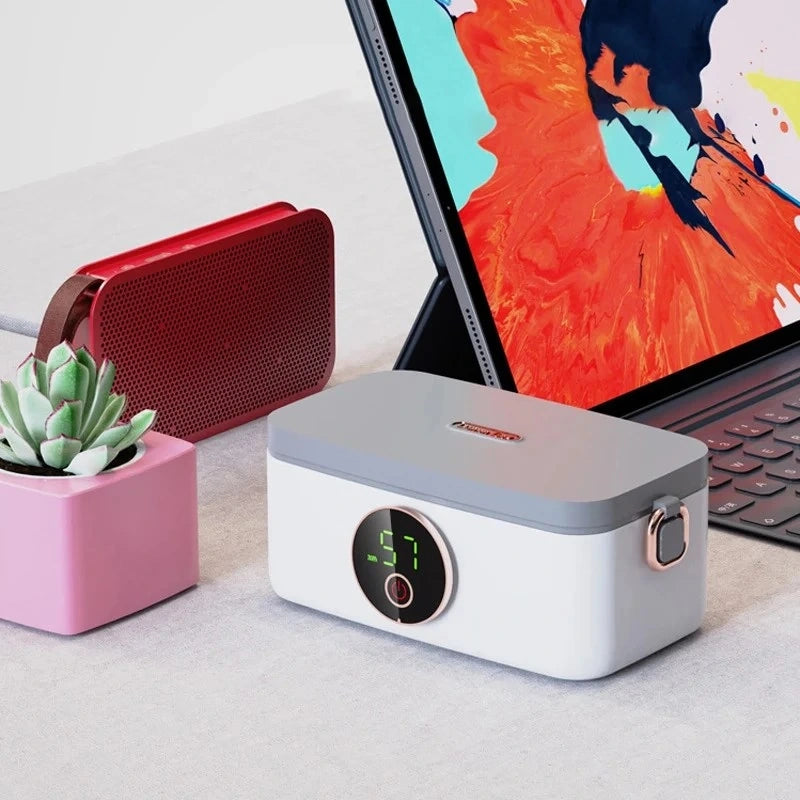 View of a sleek portable electric lunchbox in a modern design, featuring a durable exterior and convenient carrying handle