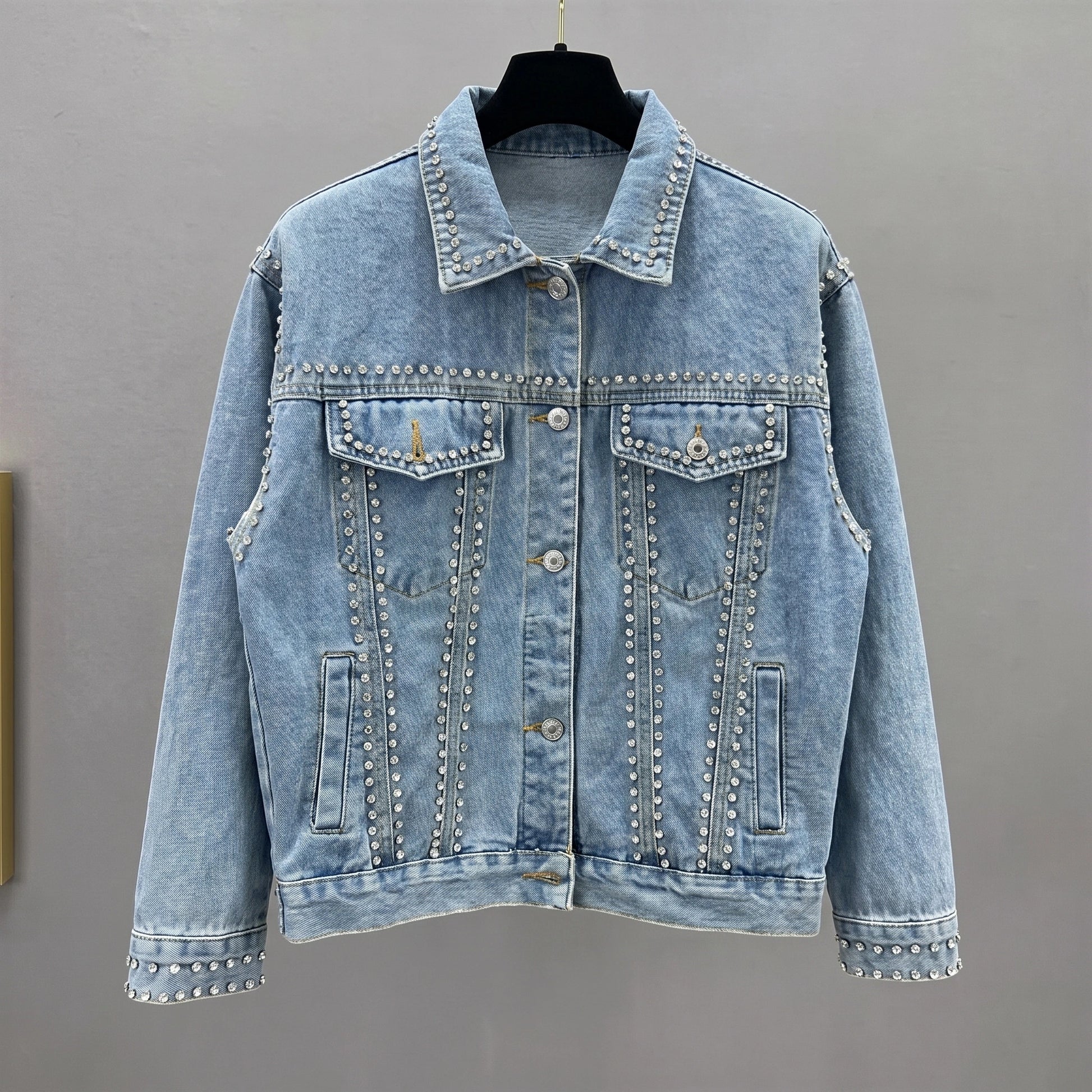Close up view of the Womens Radiant Autumn Jacket showing its luxurious fabric texture, intricate stitching, and design details against a soft neutral background.