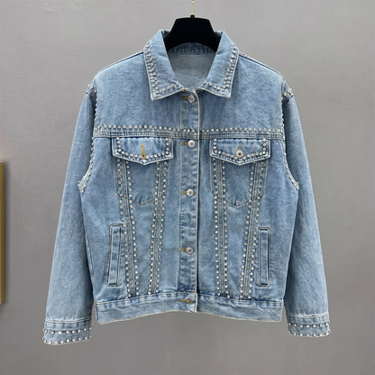 Close up view of the Womens Radiant Autumn Jacket showing its luxurious fabric texture, intricate stitching, and design details against a soft neutral background.