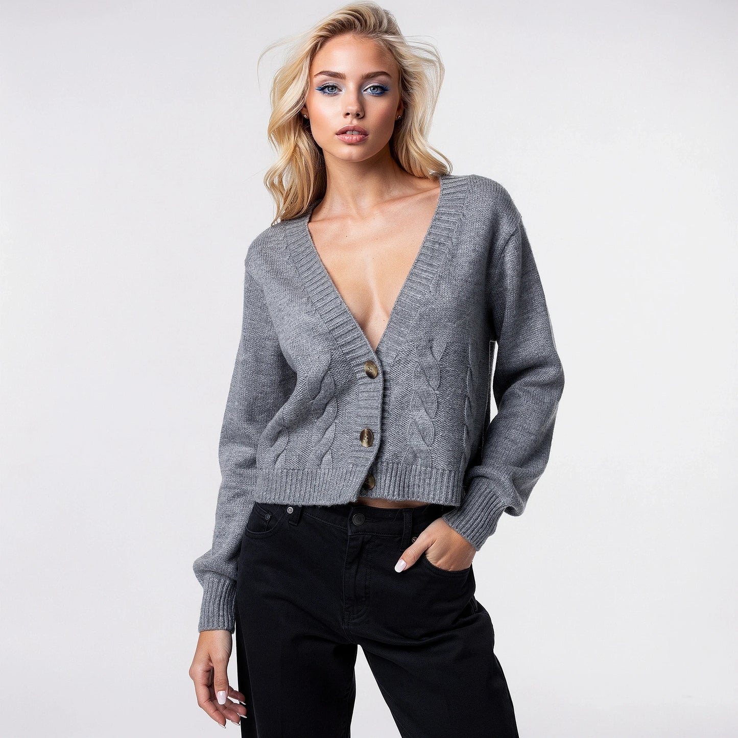 View of a warm, cropped sweater in soft beige knit with a twisted at the