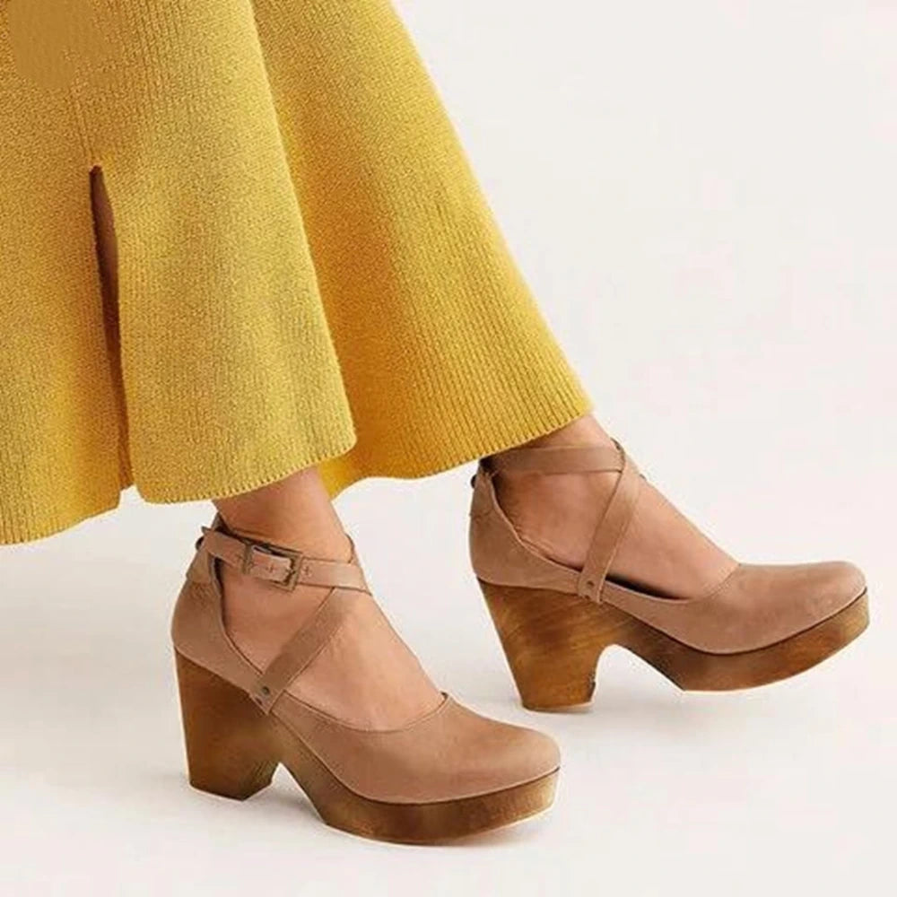 View of elegant summer sandal featuring a soft beige leather upper, delicate straps, and a comfortable low heel
