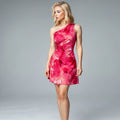 View of a cut out waist dress in vibrant red, featuring a fitted bodice and flowing skirt made of lightweight fabric