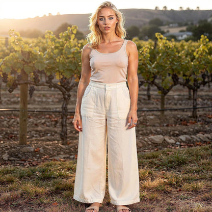 View of elegant high waisted wide leg pants in soft fabric, featuring a smooth waistband and flowing silhouette