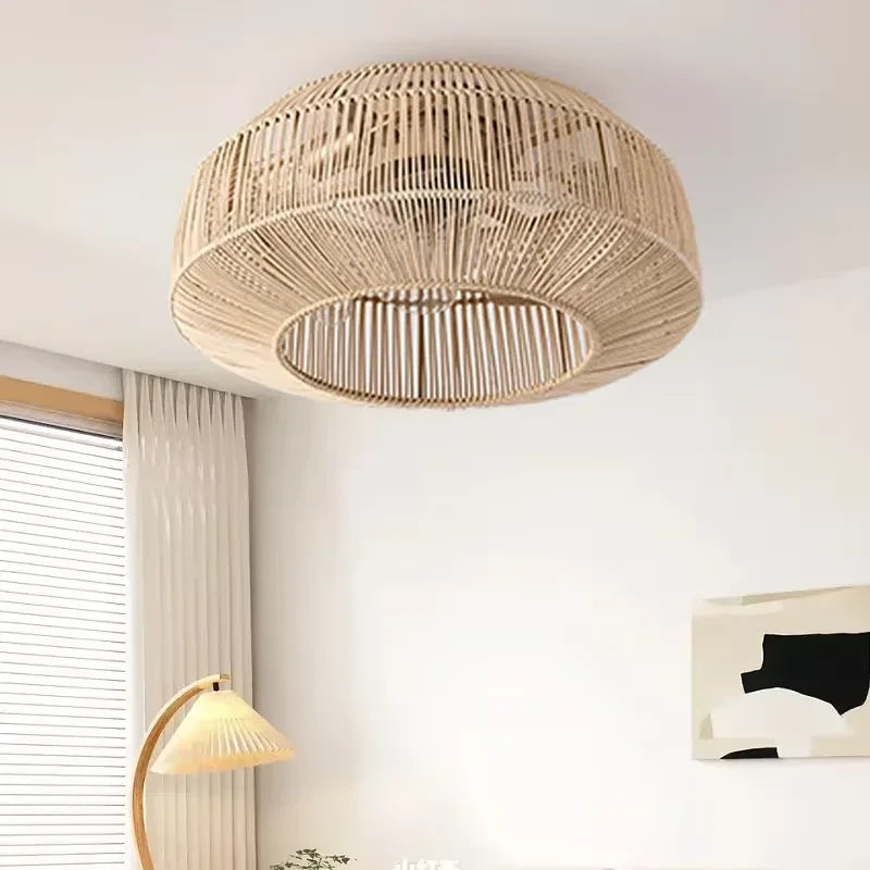 Of the fan's elegant rattan blades showcasing intricate weaving patterns and integrated LED lighting design