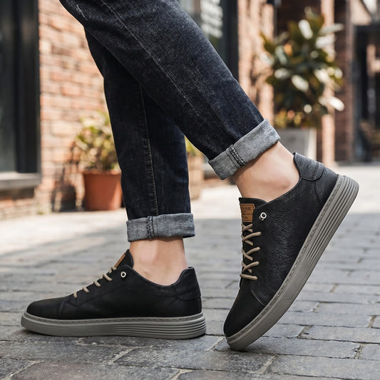 Close up view of the men's casual sneakers showing the intricate stitching and fabric texture against a neutral background.
