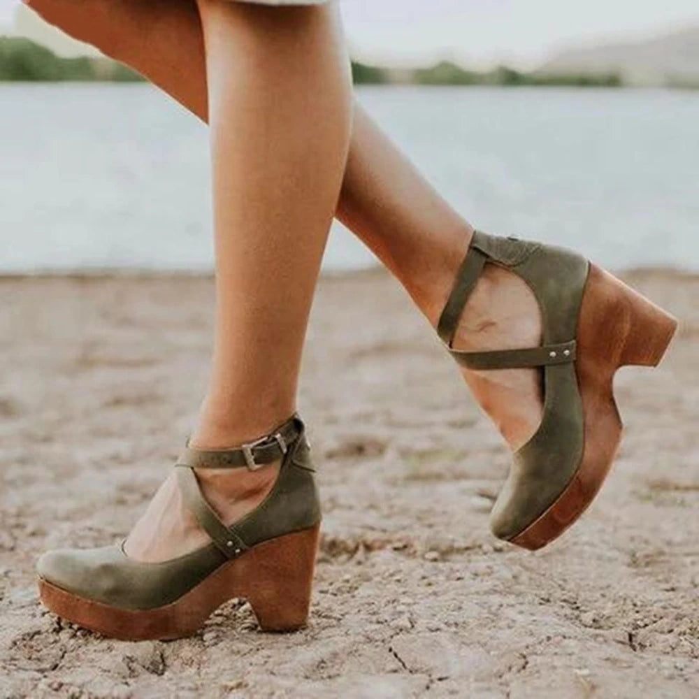 View of elegant summer sandal featuring a soft beige leather upper, delicate straps, and a comfortable low heel