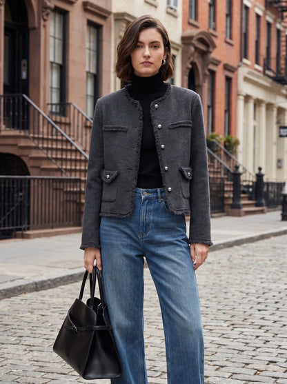 Close up view of the Womens Tailored Autumn Jacket showing the frayed edges and intricate stitching details against a neutral background.