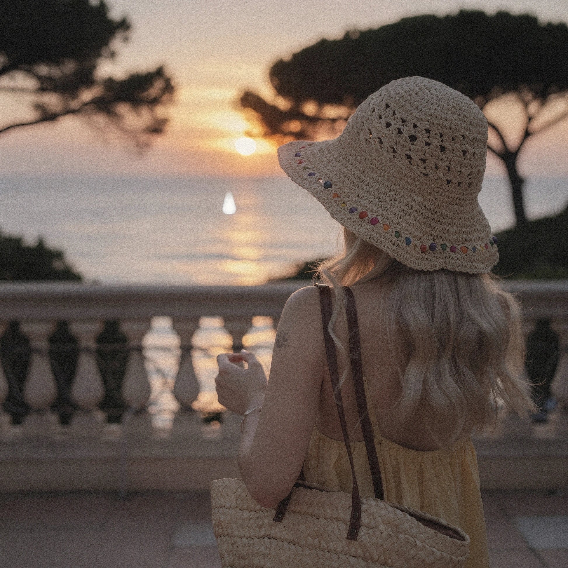 Colorful crochet summer bucket hat featuring a wide brim and intricate patterns, detailed view showcasing vibrant hues