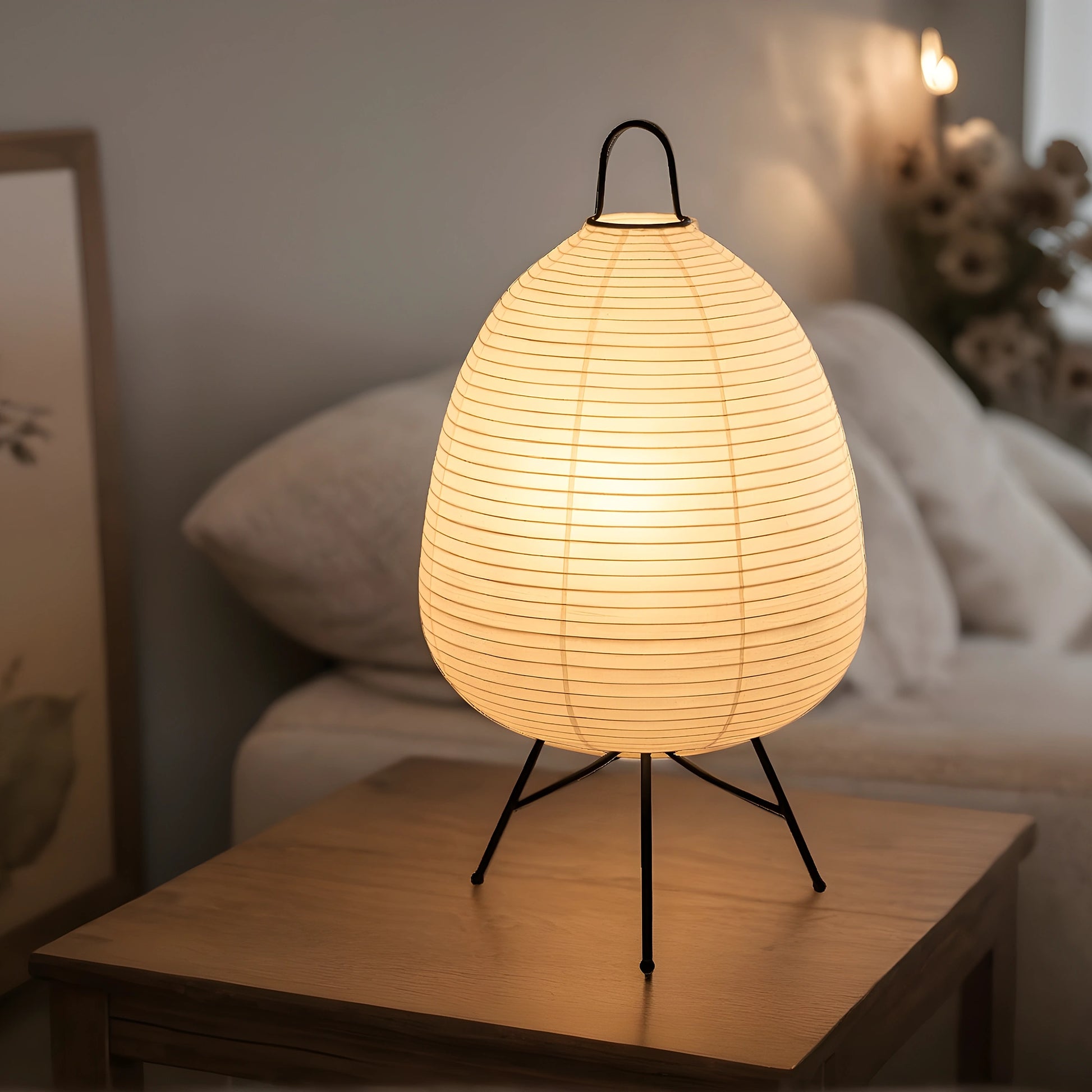 View of a serene minimalist rice paper table lamp, featuring a soft white shade and a natural wood base