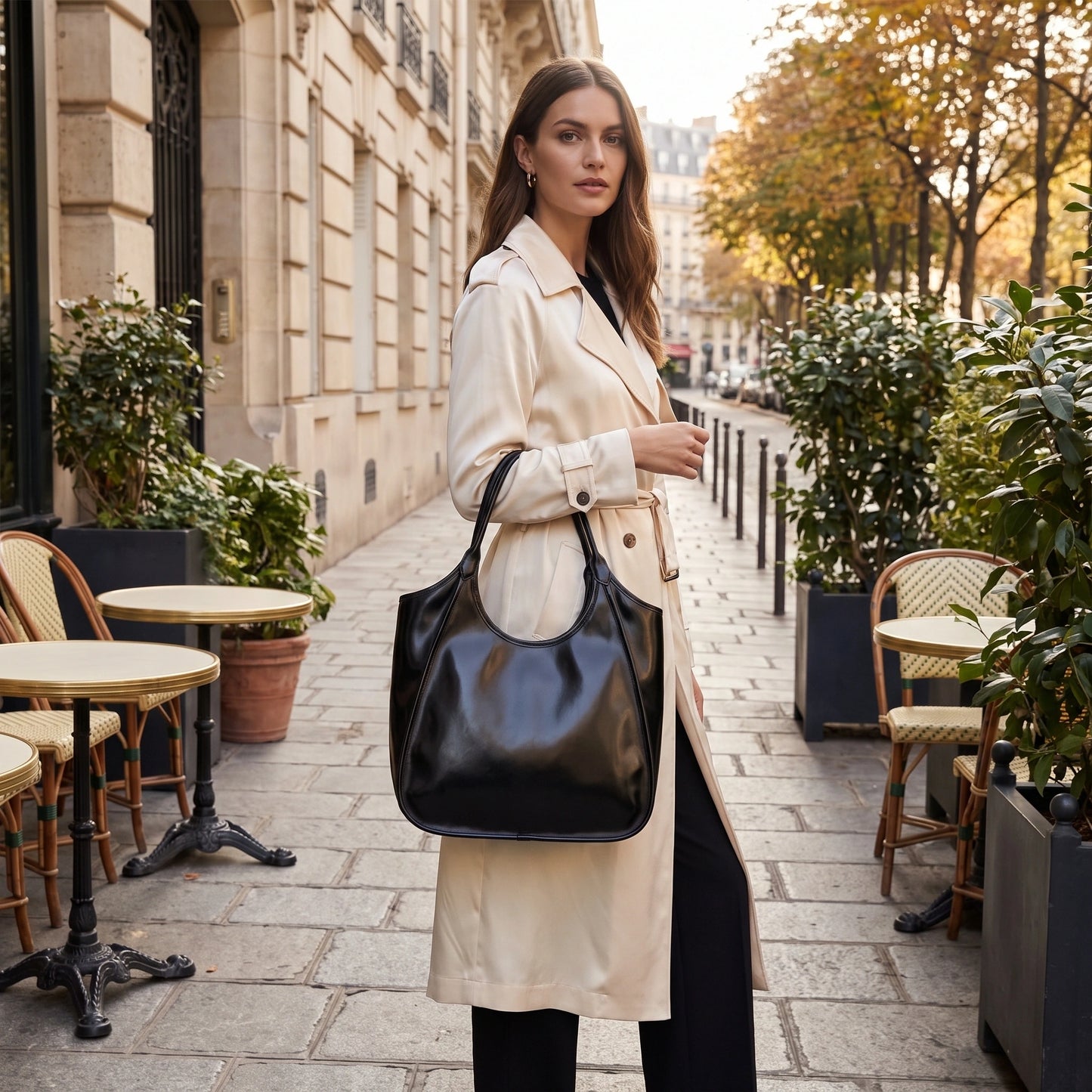 Close up view of the glossy cowhide texture and precise stitching details Roma Tote Bag, showing its luxurious — view 5
