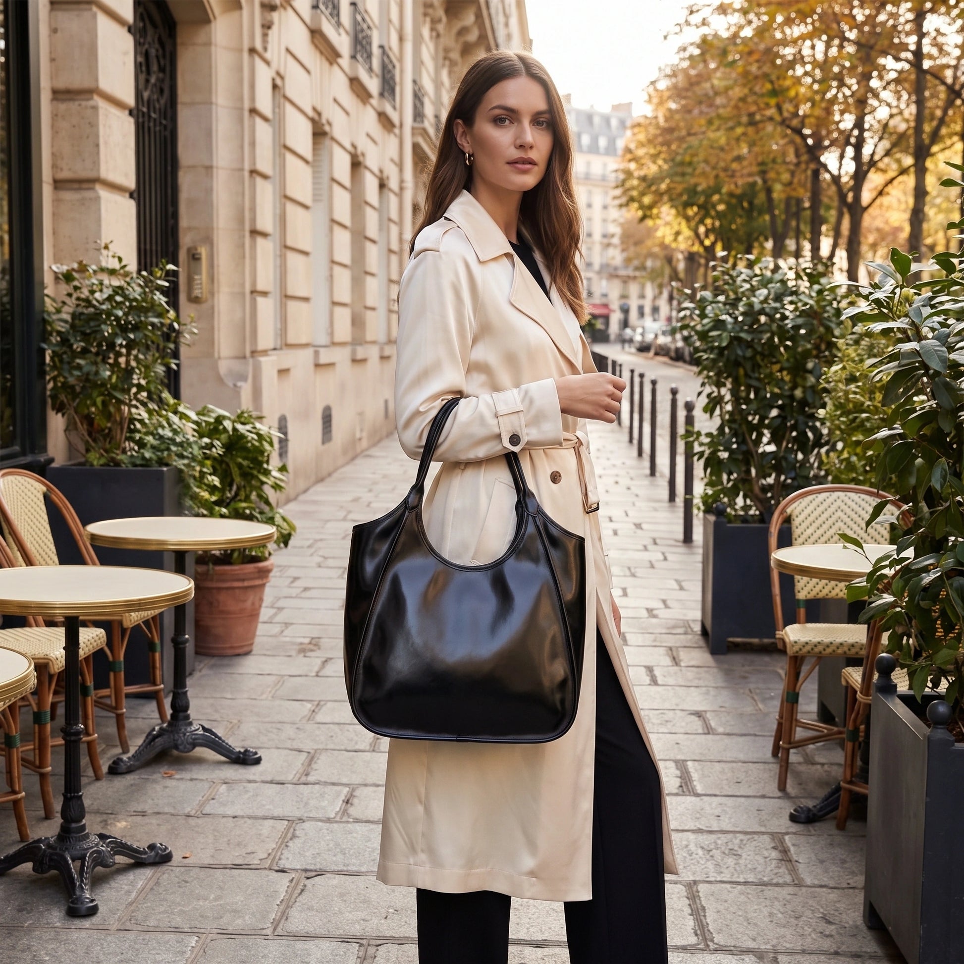 Close up view of the glossy cowhide texture and precise stitching details Roma Tote Bag, showing its luxurious — view 5