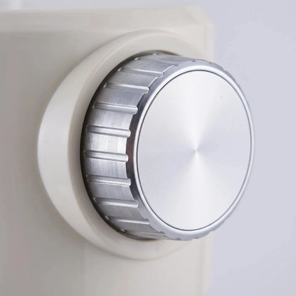 View of the ice shaver's stainless steel blades and control buttons, highlighting precision design and user friendly interface