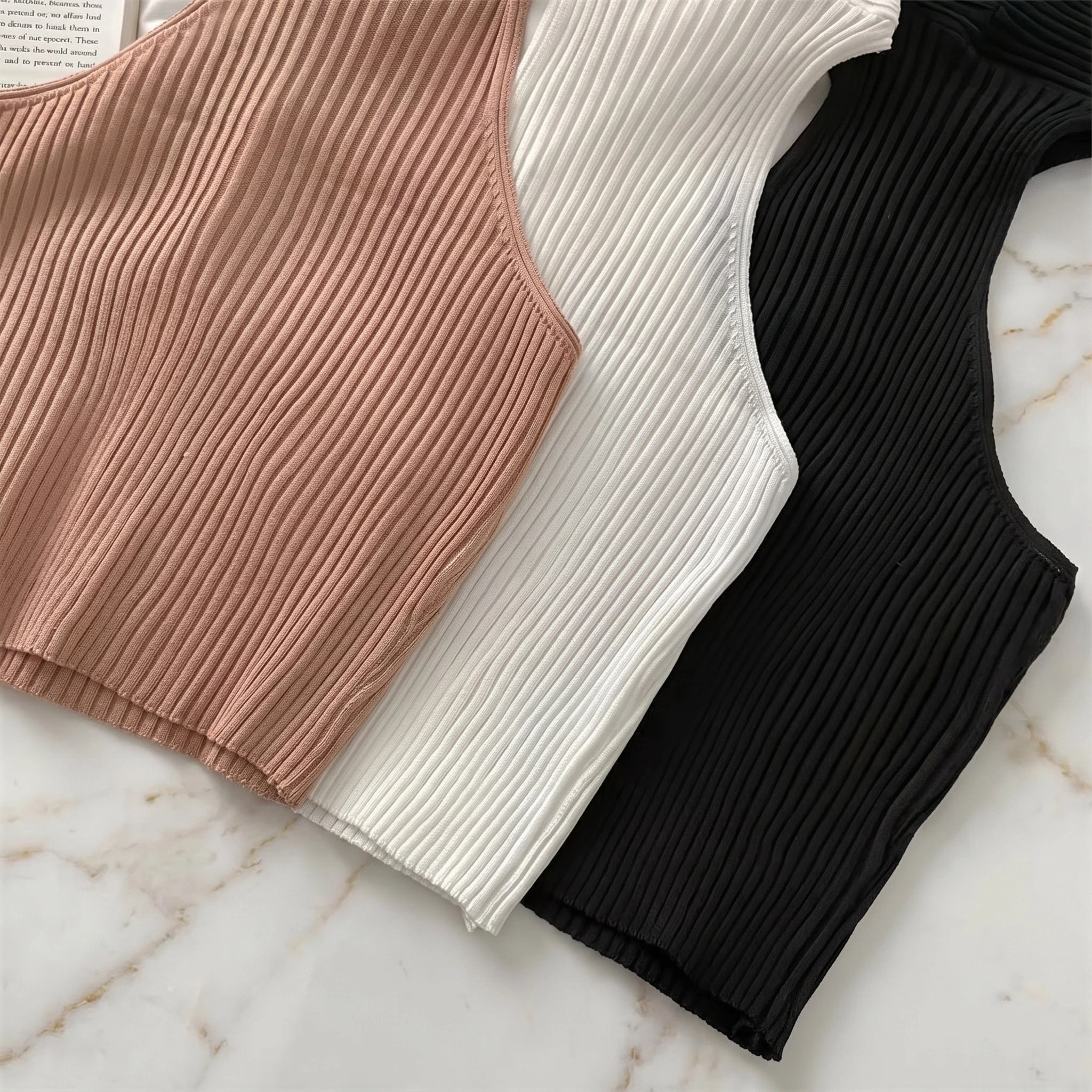 Close up view of the Womens Sleek Minimalist Summer Crop Top showing its smooth fabric texture, precise stitching, and modern design details against a neutral background.